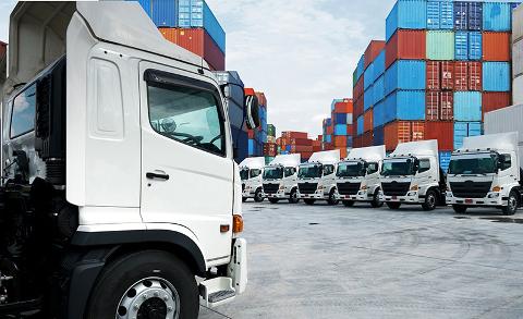 Haulage lorry's at shipping container storage park in Purefleet